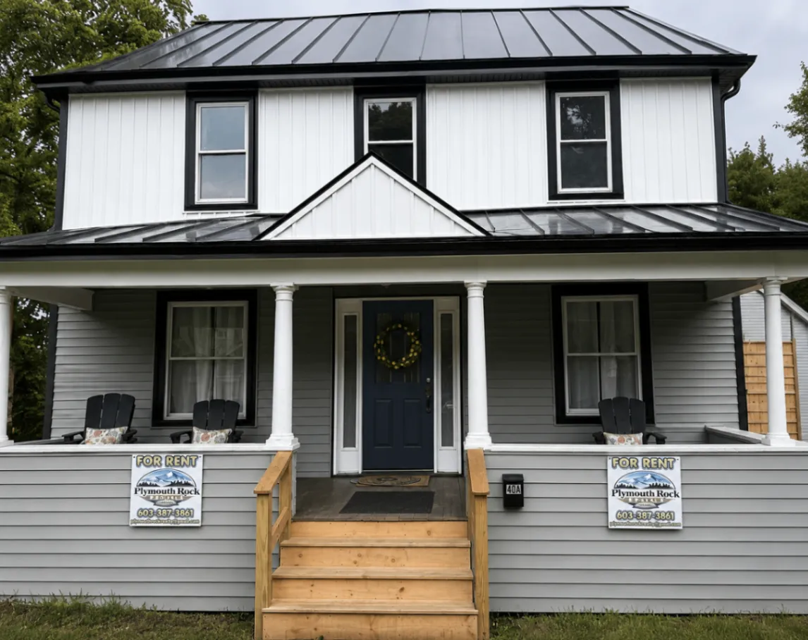 Renovated gray-and-white rental home with welcoming front porch