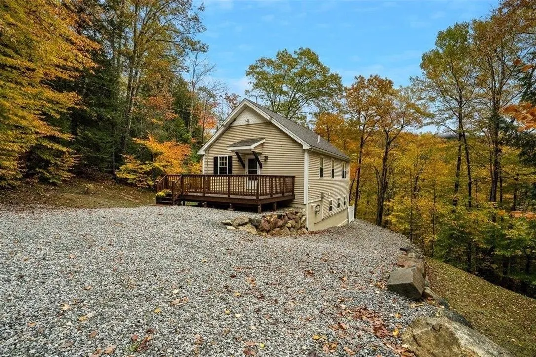 Woodland cabin surrounded by autumn trees
